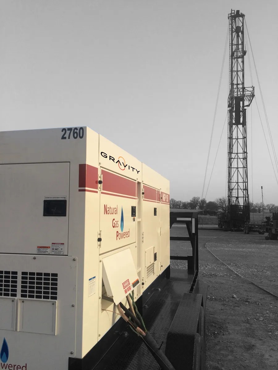 Generator next to a drilling rig